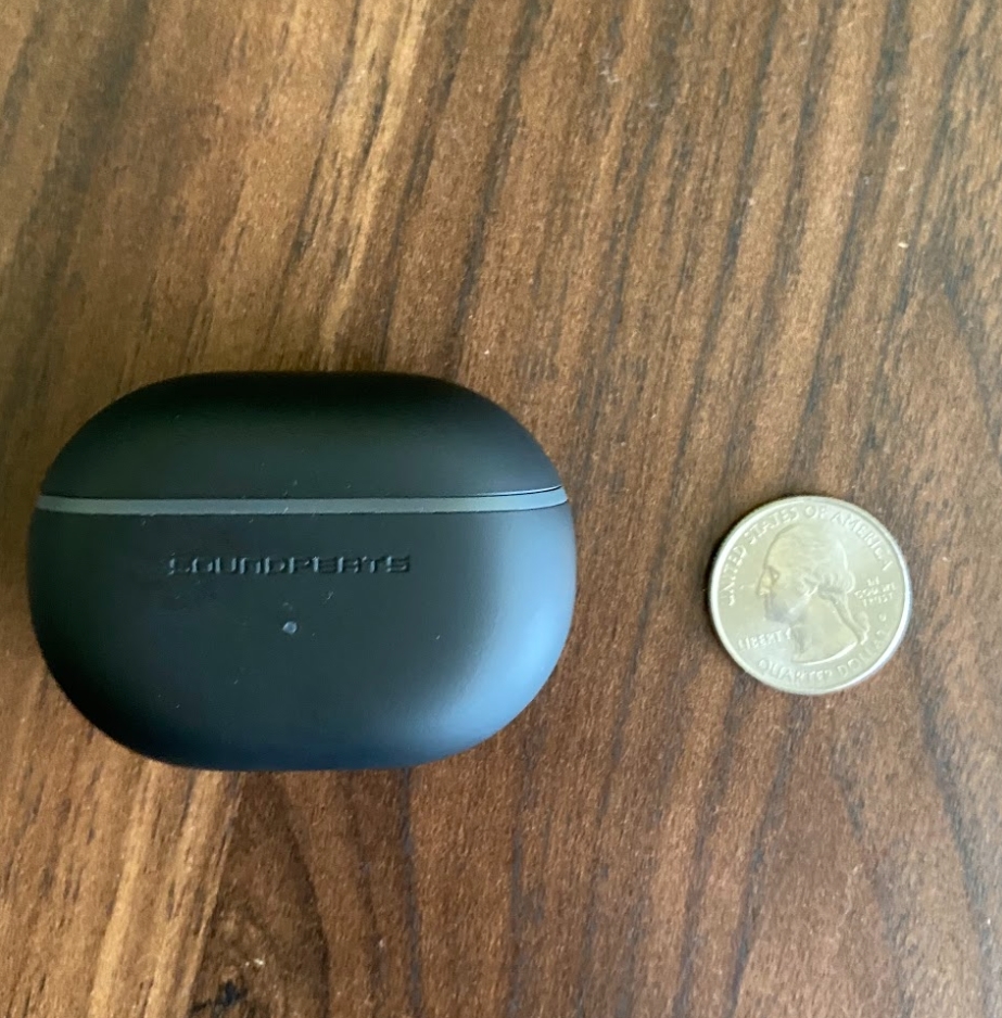 Soundpeats Mini Pro charging case with quarter for scale